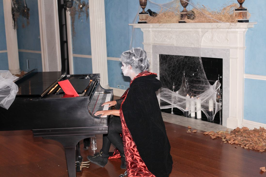 Spooky lady playing the piano<br/>